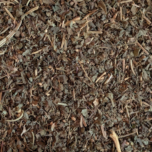 Close-up of dried herbs and leaves with a brown and green color palette.