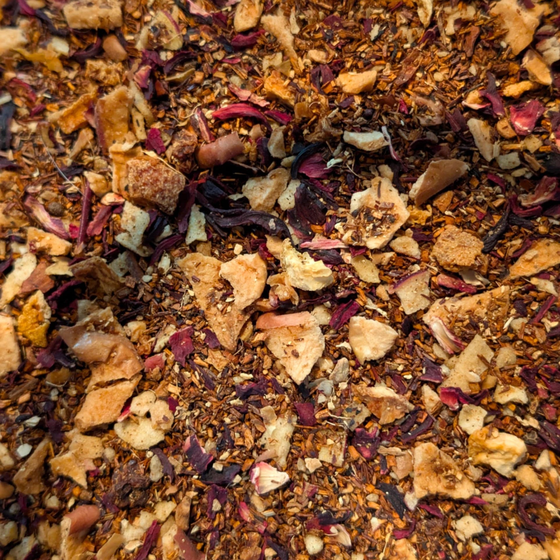 Close-up of a mix of dried herbs and spices with various colors.