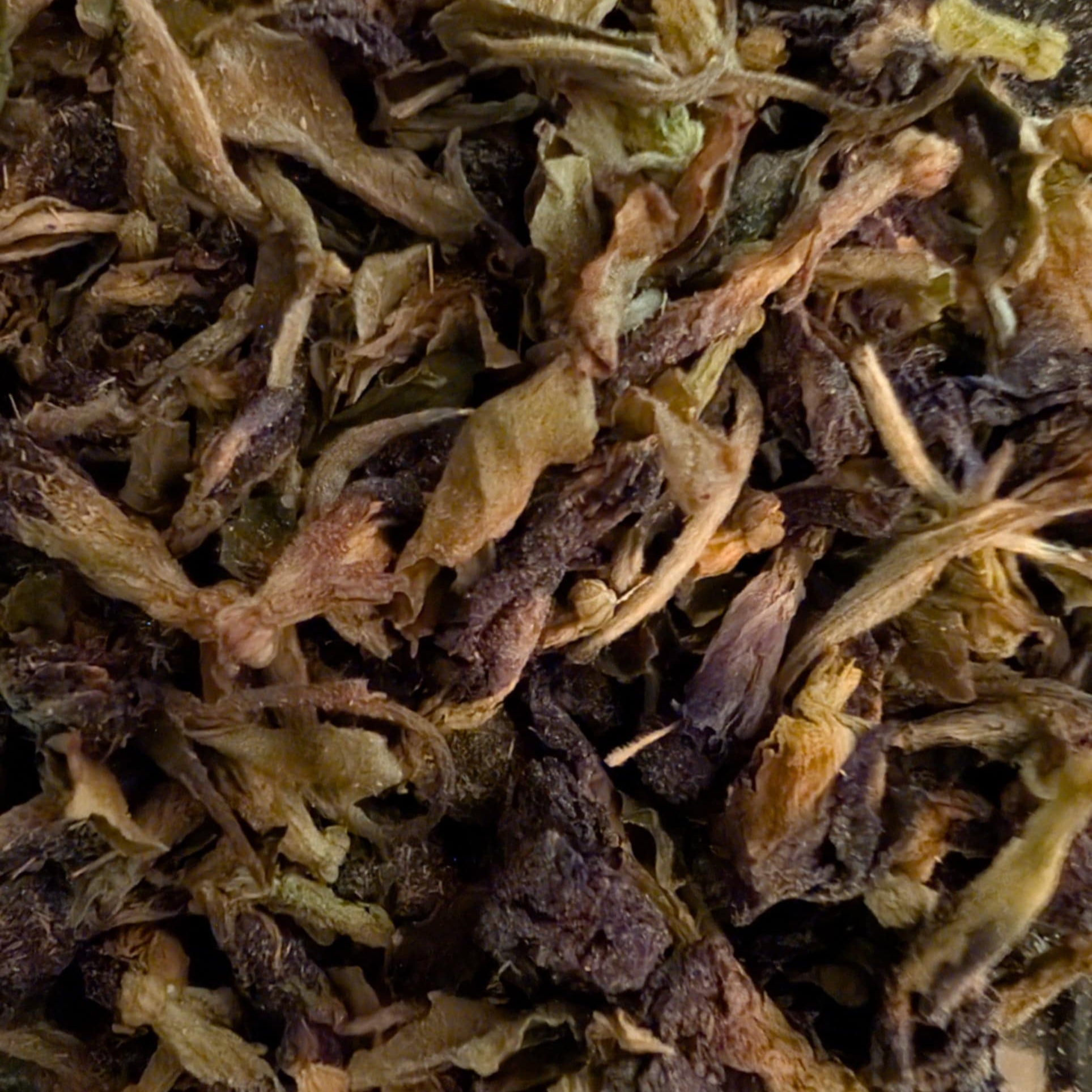 Close-up of dried tea leaves with a focus on texture and color.