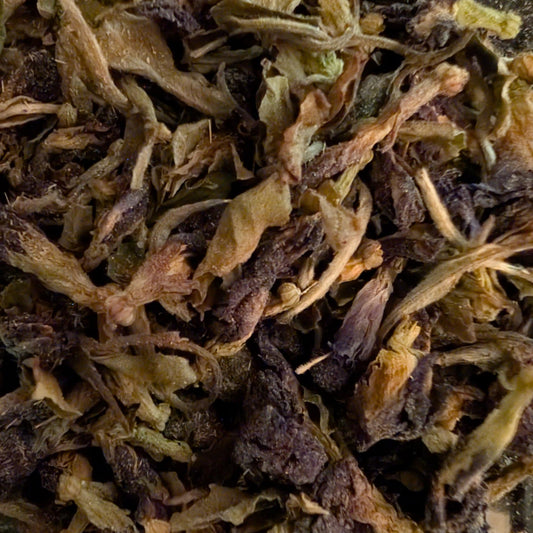 Close-up of dried tea leaves with a focus on texture and color.