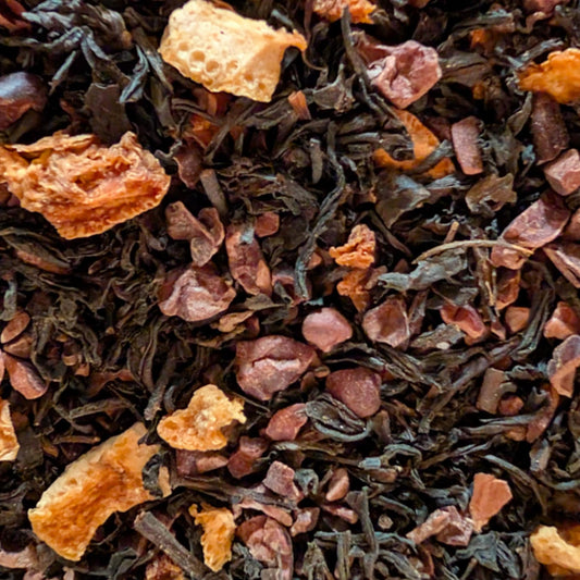 Close-up of black tea leaves with dried fruit pieces