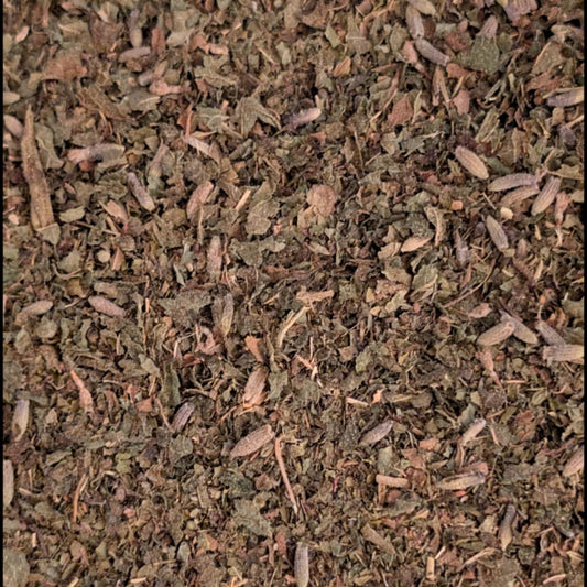 Close-up of dried herbs or spices with a brown and green color.